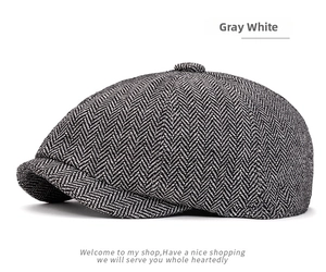 Detail of gray white newsboy cap featuring classic herringbone tweed pattern and top button