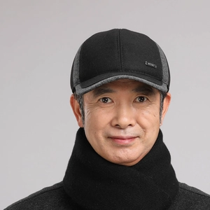 Close-up of thick winter baseball cap and scarf set for men featuring a metal Sport badge