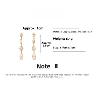 Detail view of pearl tassel earrings showing copper zircon material and 6.5cm length