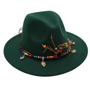 Detail of colorful beads and natural seashells on a dark green fedora hat band