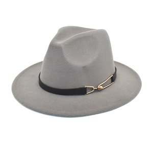 Detail of grey wool fedora hat featuring black leather belt and gold horsebit buckle