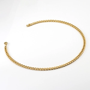 Detail of 18K gold stainless steel Cuban link chain with a secure lobster clasp