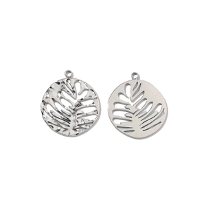 Close-up of polished stainless steel hollow monstera leaf pendants with silver finish
