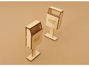 Macro shot of two miniature wooden mailboxes with POST engraving for dollhouse decor