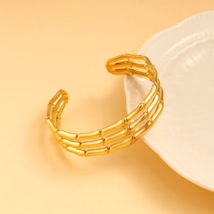 Three-row bamboo-style open gold bracelet made of polished 18K gold plated stainless steel