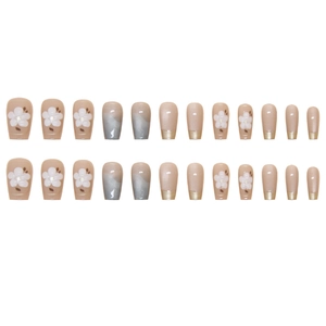 Cat-eye press-on nails set with elegant nude pink base and delicate white flower patterns