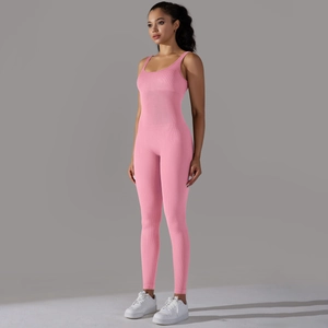 Detail view of the ribbed fabric and seamless slim fit cut on this pink yoga jumpsuit