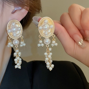 Vintage palace style oval earrings with faux pearl tassels and gold base for women