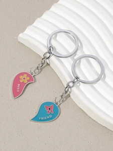 Detail of pink and blue heart-shaped Best Friend keychain set with split design