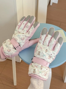 Detailed view of pink bear pattern winter gloves with anti-slip grip and wrist strap