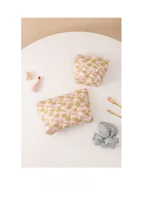Detail of floral embroidery makeup bag set with small and large travel pouches