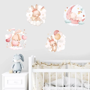 Detail view of watercolor rabbit stickers on cloud and moon in a cozy nursery bedroom