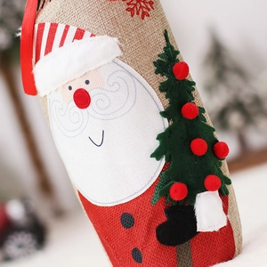 Embroidered burlap Christmas wine bottle bag with Santa Claus and festive tree design
