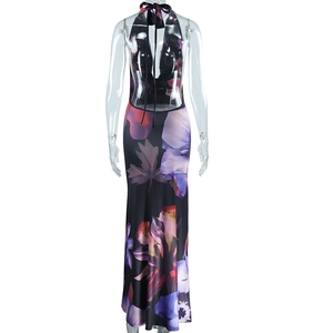 Detail of backless halter maxi dress with digital floral print and sleek tie-up neckline
