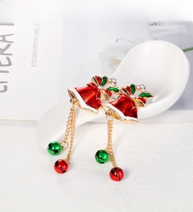 Detailed view of Christmas bell earrings with red green enamel and crystal accents