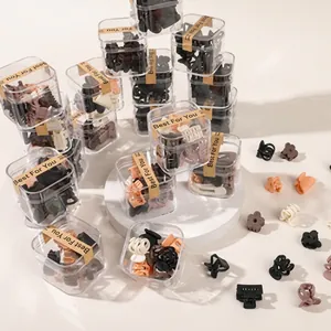 Matte mini hair claw clips in earth tones with transparent storage box and gift label