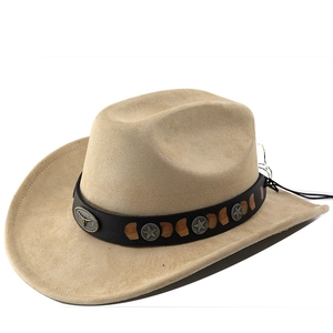 Detail of beige suede cowboy hat featuring star studs and bull head emblem