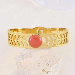 Bohemian gold stainless steel open bangle with orange cat-eye stone on stone base