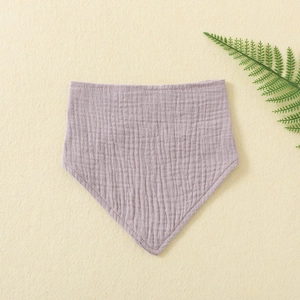 Close-up of soft lavender double-layer cotton gauze bib for infants showing fabric texture