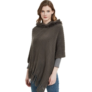 Women's dark brown knit poncho with a faux fur hood and elegant fringe hem details