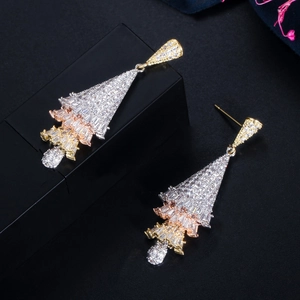 Macro detail of Christmas tree earrings with tri-color plating and micro-paved zircons