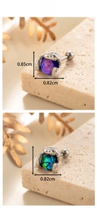 Macro detail of snake claw cartilage stud with purple and green stones, 0.85cm height