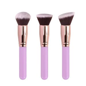 Three professional makeup brushes with purple handles and rose gold tubes on white back