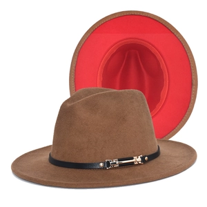 Detailed view of brown felt fedora hat featuring red brim lining and gold buckle trim