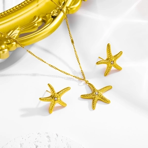 Golden starfish jewelry set with sparkling rhinestones including necklace and earrings