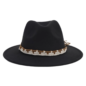 Detailed view of black wide-brim felt fedora with woven brown and white band