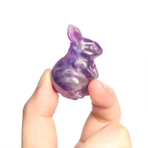 Handcrafted purple crystal rabbit figurine with detailed carving and natural gemstone texture