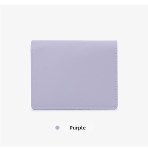 Close-up of a purple matte leather wallet showing clean stitching and smooth texture