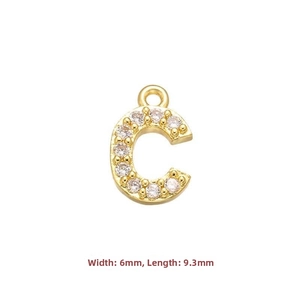 Detailed macro of gold-plated letter C pendant with micro-pave zircons, 6mm x 9.3mm size