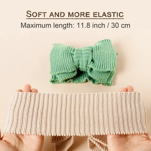 Soft knitted baby headbands with large bows showing 11.8 inch stretch capacity