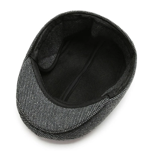 Internal view of men's grey herringbone wool flat cap with thick warm lining for winter
