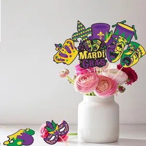 Mardi Gras party decorations set with masks and crowns in a floral vase display