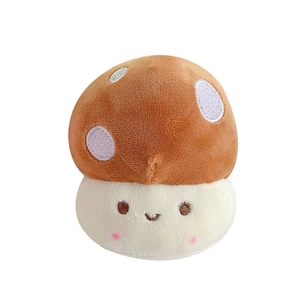 Cute brown plush mushroom keychain with white spots and embroidered smiley face detail