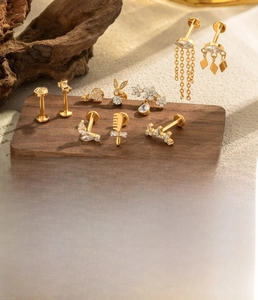 Detailed view of G23 titanium labret studs with micro-set zircon in various shapes
