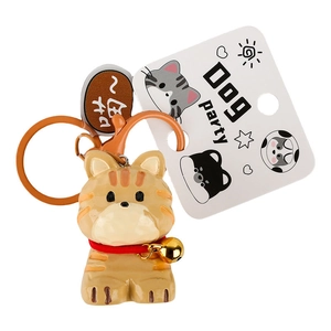 Cute resin cat keychain with orange stripes, gold bell, and hanging clip on display card