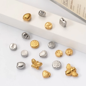 Detail of assorted gold and silver stainless steel beads for DIY jewelry making
