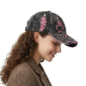 Vintage distressed denim baseball cap with washed ripped pink lines and curved brim