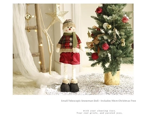 Detail of retractable Christmas snowman doll with red plaid outfit for holiday decor