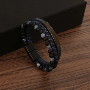 Detail of multi-layer leather bracelet with matte black beads and magnetic metal clasp