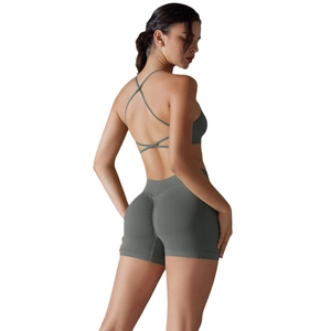 Dark grey backless sports bra and scrunch butt yoga shorts set showing muscle details