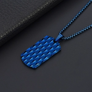Macro shot of blue titanium steel military tag necklace with diamond-cut texture details