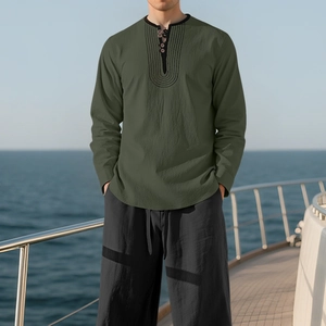 Detail of army green linen shirt with Henley collar and buttons on a boat deck