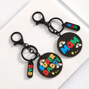 Colorful Mom and Super Daddy wooden acrylic keychains with rainbow star patterns