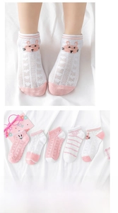 Detail of five pairs breathable mesh kids socks with cute bunny patterns and stripes