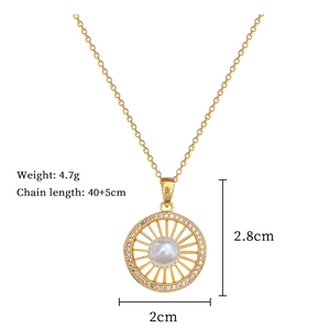 Detail of gold sunburst pendant with pearl and crystals including size and weight specs
