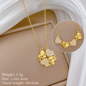 Detail of gold clover heart necklace showing magnetic transformation with crystal inlay